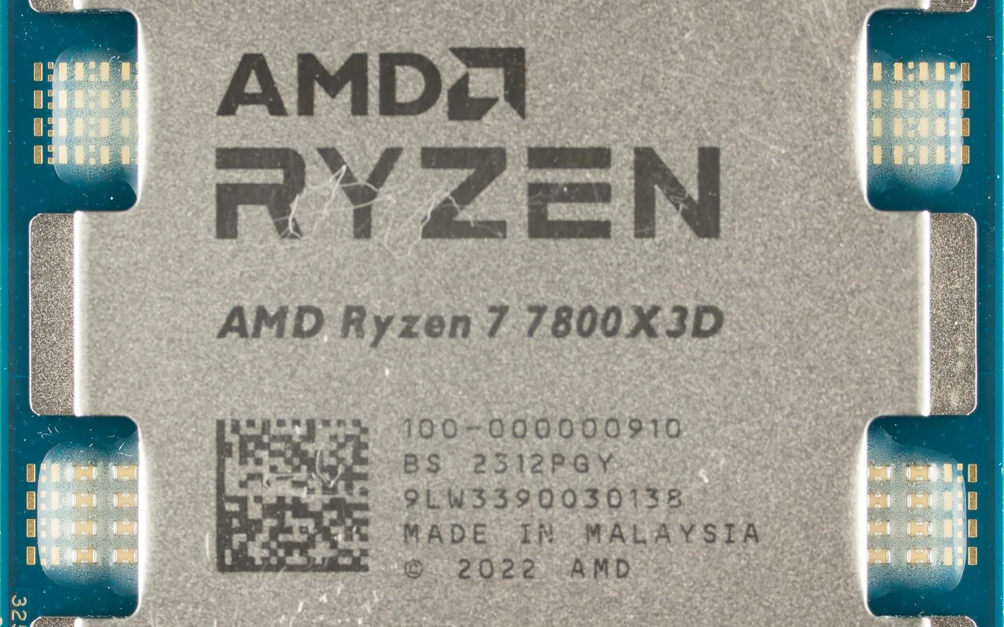 Photograph of a Ryzen 7 7800X3D processor die showing the stacked 3D V-Cache CCD