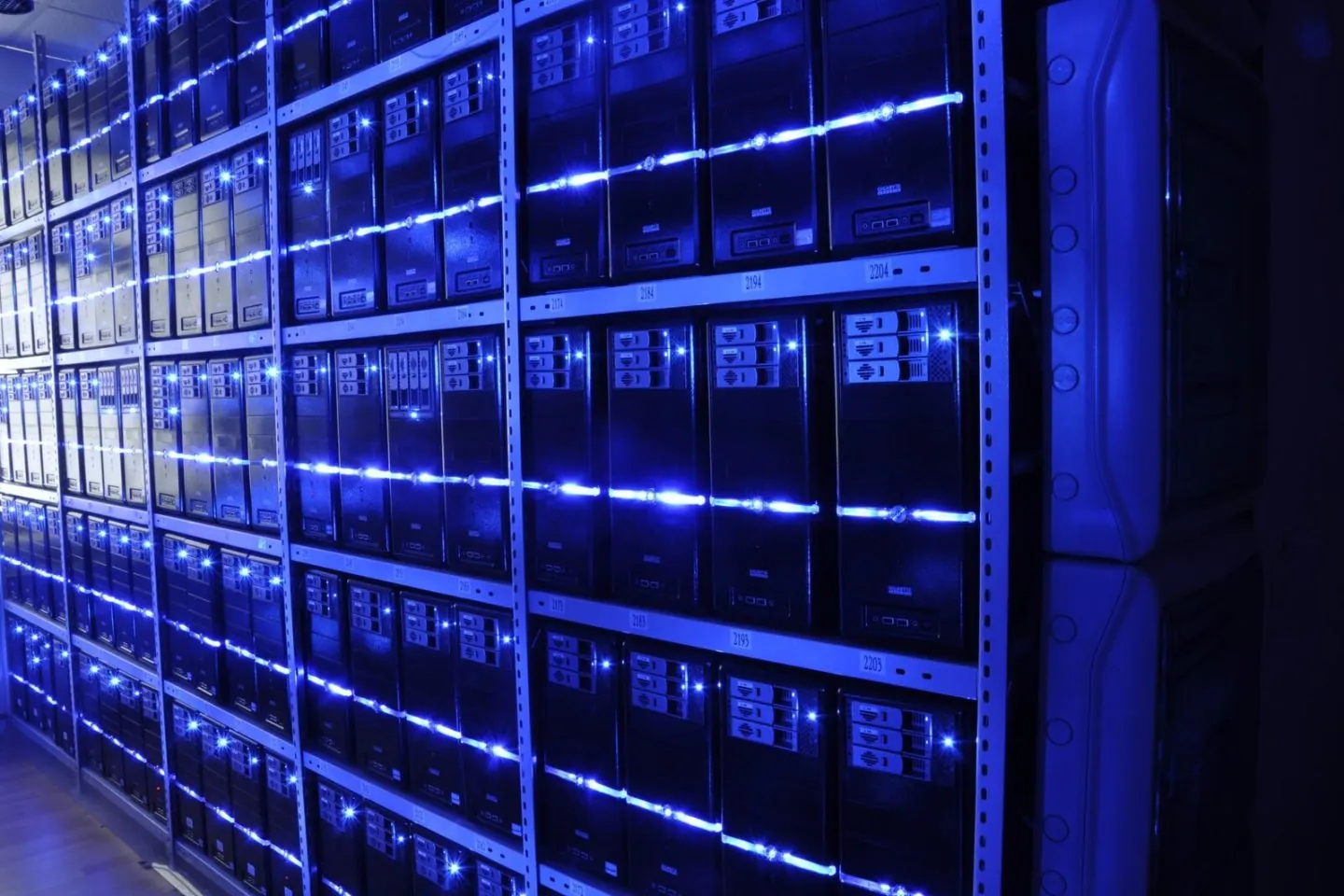 Representative data-center server racks illustrating infrastructure around OpenAI’s Astra cybersecurity model