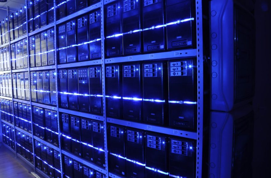 Representative data-center server racks illustrating infrastructure around OpenAI’s Astra cybersecurity model