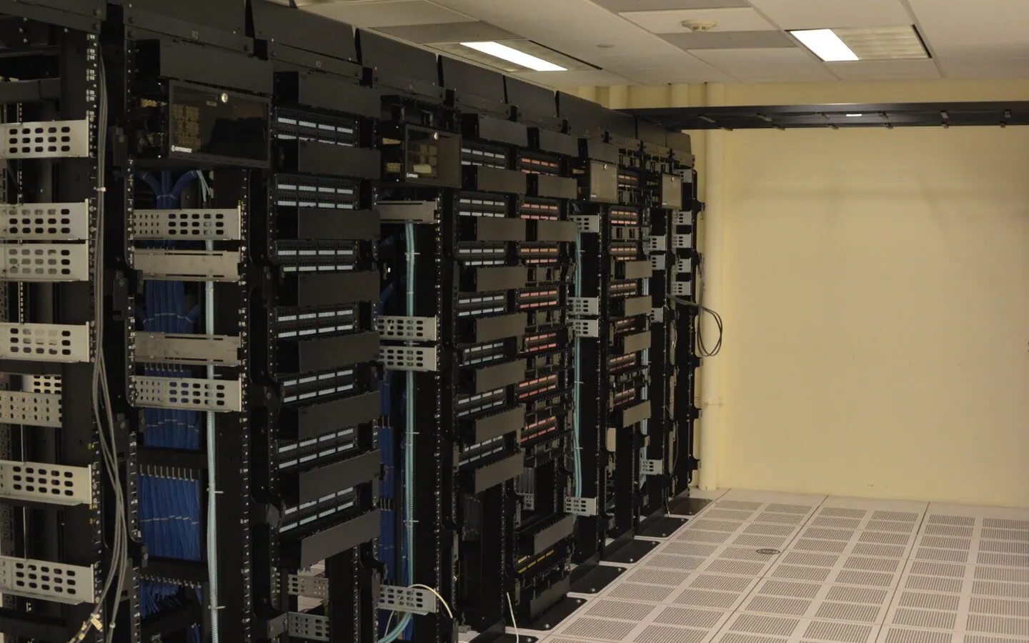 Server racks in a data center, representative of AI infrastructure